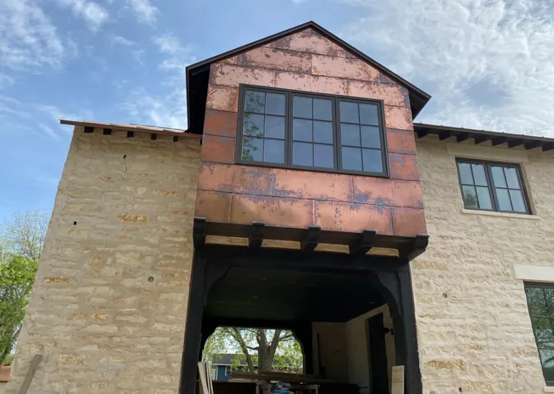 Copper metal panel facade on a stone building for Metal Roof Coating in Irvington